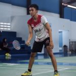 an active man playing badminton