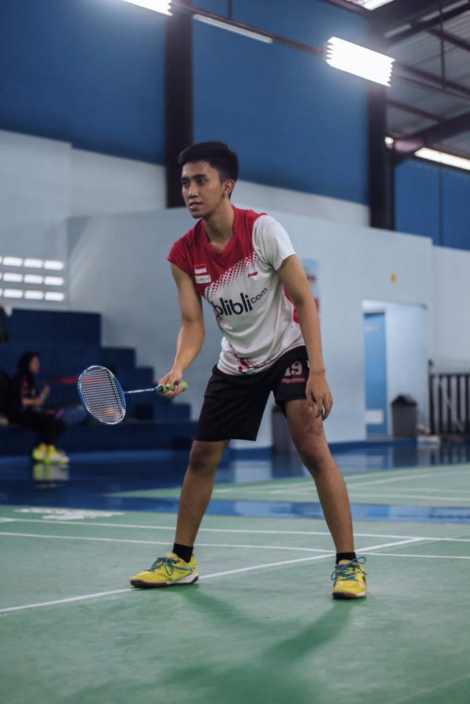 an active man playing badminton